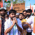 Cockroach Janta Party (CJP) founder Abhijeet Dipke leads a massive student protest at Delhi’s Jantar Mantar using plates and spoons to demand action on the NEET paper leak crisis.