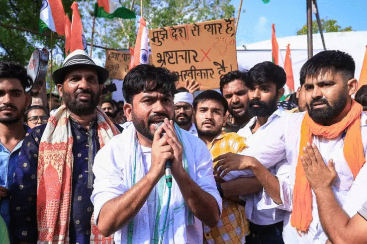 Cockroach Janta Party (CJP) founder Abhijeet Dipke leads a massive student protest at Delhi’s Jantar Mantar using plates and spoons to demand action on the NEET paper leak crisis.